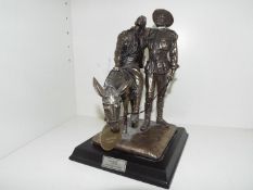 Silent Soldiers, Man with Donkey, a sculpture mounted on an ebonized plinth,