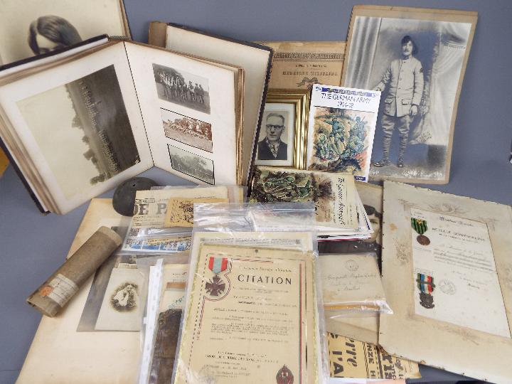 A collection of various military related items to include correspondence, citations, post cards,