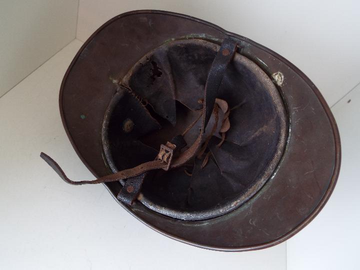 A late 19th / early 20th century French fireman's Adrian pattern brass helmet with side plume - Image 3 of 3