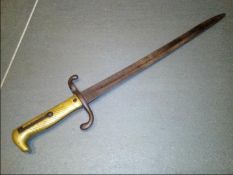 An Imperial German M1871 bayonet for the 1871/84 Mauser Rifle, the bayonet with a brass hilt,