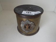 Trench art of cylindrical form with The Royal Scots badge applied to the side,
