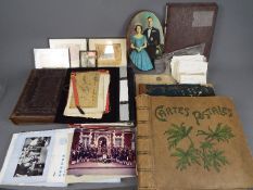 A mixed lot to include photograph and postcard albums, trench art, Soldbuch,