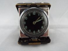 An Art Deco styled purse watch or small travelling clock,