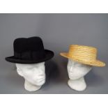 Two vintage hats comprising a G A Dunn & Co London homburg (approximately 60 cm internal