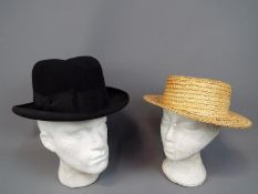 Two vintage hats comprising a G A Dunn & Co London homburg (approximately 60 cm internal