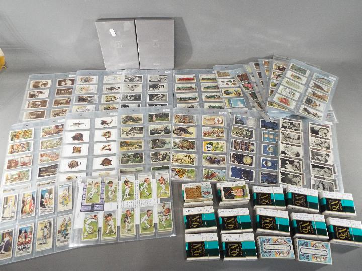 A large collection of cigarette cards, with complete sets, to include Lucky Charms, Roses,