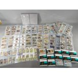 A large collection of cigarette cards, with complete sets, to include Lucky Charms, Roses,