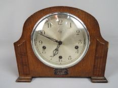 An Enfield Royal mantel clock, Arabic numerals to the dial, movement marked 'Made in England',