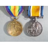 A WWI medal pair comprising Victory Medal and British War Medal, named to 200271 A. SJT. H. ACKROYD.