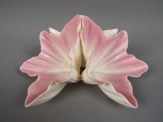 A small Grainger & Co floral style centerpiece, approximately 7 cm (h), one small chip to the rim.