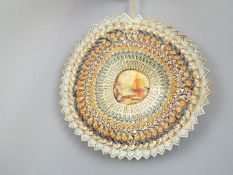 A folk art, wall hanging piece made from interwoven Players cigarette packets,
