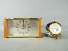 A Dalvey St Elmo travel alarm clock and a Westclox mantel clock.