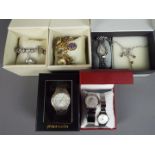 A collection of boxed fashion watches.