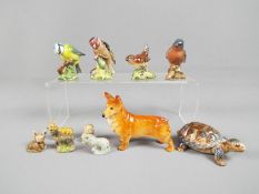 Four Beswick bird figurines, 991 Chaffinch, 993 Wren, 992 Bluetit, 2273 Goldfinch,