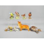 Four Beswick bird figurines, 991 Chaffinch, 993 Wren, 992 Bluetit, 2273 Goldfinch,