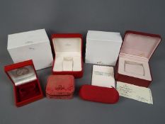 A collection of Omega watch boxes.