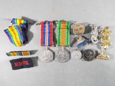 A WWII medal pair comprising Defence Medal and War Medal 1939-1945 along with a Silver War Badge,