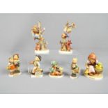 Hummel - Seven Hummel figurines including Out of Danger, Merry Wanderer, Village Boy and similar.