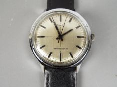 A gentleman's Timex wristwatch with leather strap.