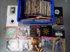 Approximately two hundred 7” vinyl records, predominantly rock and pop to include Bob Marley,