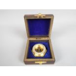 A Henry Hughes boxed brass compass