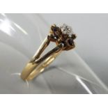 A 9ct gold hallmarked, stone set flowerhead cluster ring, size M, approximately 1.