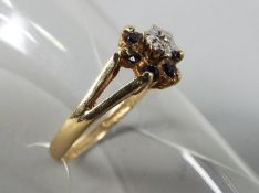 A 9ct gold hallmarked, stone set flowerhead cluster ring, size M, approximately 1.