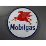 A cast iron Mobil sign.