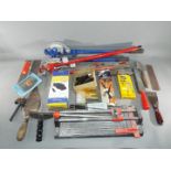 Two sets of pipe benders with a quantity of hand tools including a tile cutter, trowel, float,