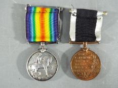 A WWI British War Medal named to PTE E V P TILLEY E SURR R and a Special Constabulary Long Service