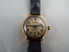 A 9 carat gold cased lady’s wristwatch by jewellers Bravingtons,