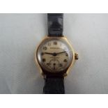 A 9 carat gold cased lady’s wristwatch by jewellers Bravingtons,