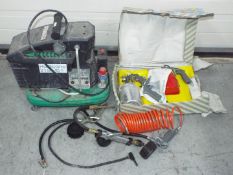 A Hurricane 2156 SP Air Compressor plus accessories.