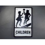 A cast 'Children' sign. (ychil).