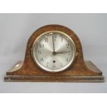 A Napoleons hat mantel clock, Arabic numerals to the dial, movement marked '14 Day British Made',