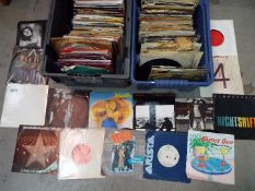 A large quantity of 7” vinyl records, predominantly rock and pop to include ABBA, The Beatles,