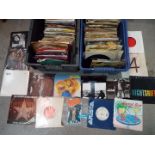 A large quantity of 7” vinyl records, predominantly rock and pop to include ABBA, The Beatles,