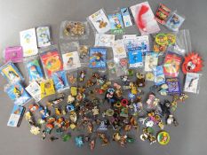 A collection of various pin badges including Noddy, Loony Tunes, Thomas the Tank Engine, Disney,