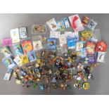 A collection of various pin badges including Noddy, Loony Tunes, Thomas the Tank Engine, Disney,