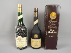 A 100 cl bottle of Pere Magloire Fine Calvados,