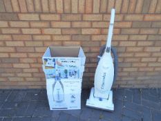 An Electrolux Powerlite Pet, upright vacuum cleaner, with box.