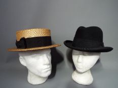 Two vintage hats comprising Woodrow of London straw boater (approximately 60 cm internal