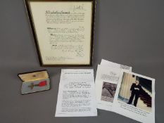 A framed MBE citation and medal awarded to Richard George Norrell in recognition of his service to