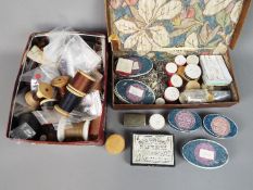 A quantity of vintage dressmakers beads, buttons and similar.