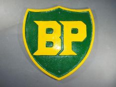 A large cast iron BP sign approximately 34 cm x 33 cm.