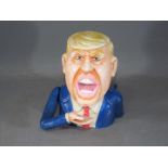 A cast money bank of Donald Trump (xbtrtu)