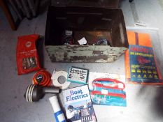 A metal trunk containing a small quantity of sailing and fishing accessories.
