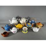 A quantity of teapots and similar to include Beswick, Oriental examples and other.