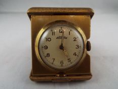 An Art Deco styled purse watch or small travelling clock,
