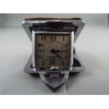 A small purse watch/ clock in a 36mm square cushion form case with brown shagreen or leather